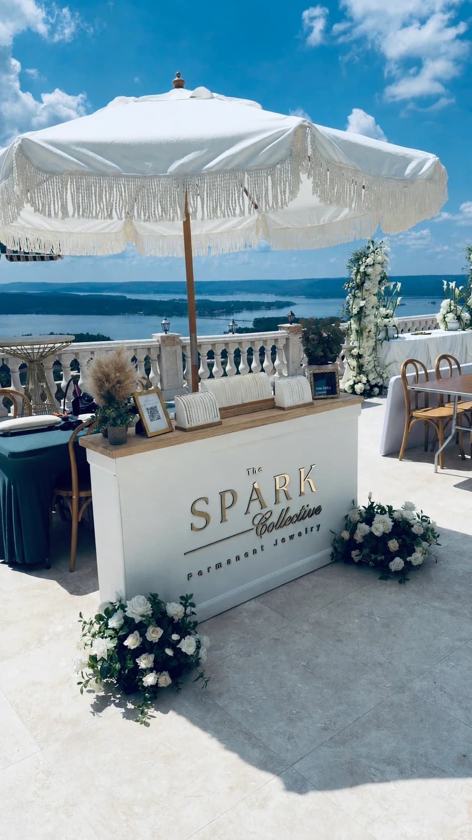 The Spark Collective permanent jewelry booth at the Stone Haven Bridal Expo in Section, Alabama.